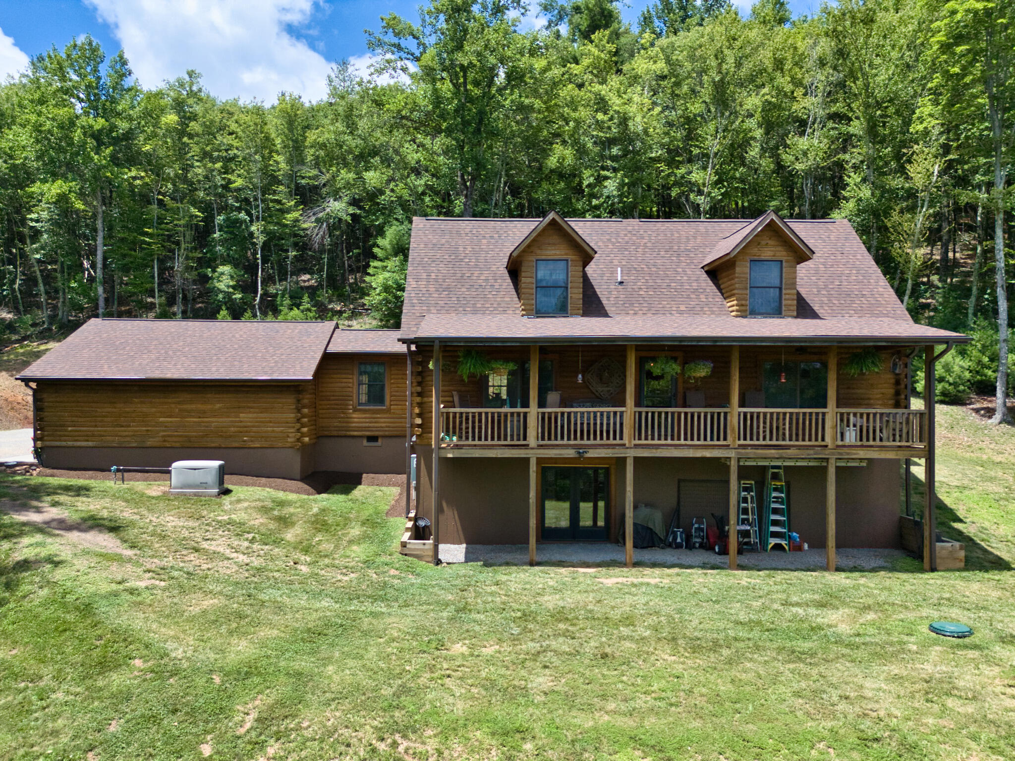567 Weeks Road Northwest Floyd, VA 24091 - Photo 2 of 71 a view of a house with a large window and a yard