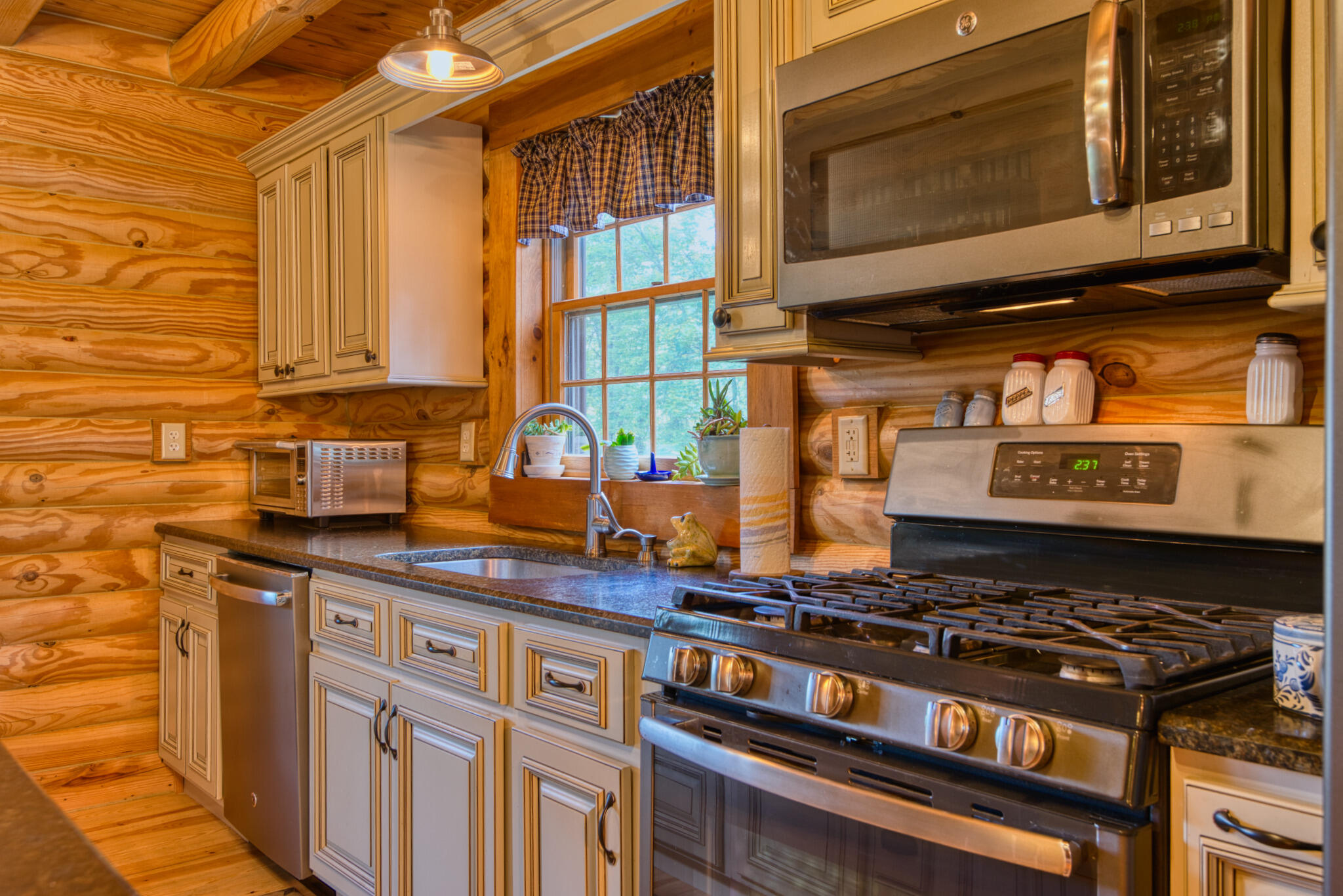 567 Weeks Road Northwest Floyd, VA 24091 - Photo 32 of 71 a kitchen with stainless steel appliances granite countertop a stove and a microwave