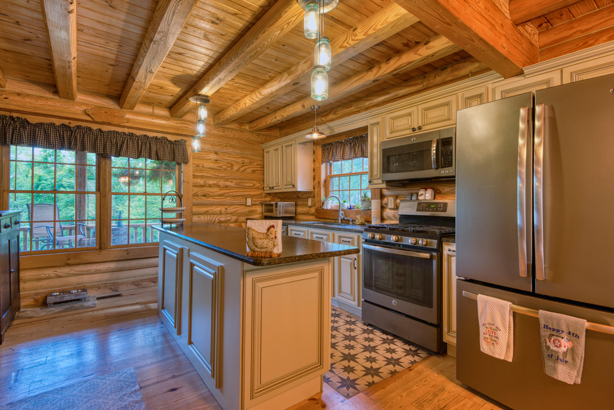 567 Weeks Road Northwest Floyd, VA 24091 - Photo 35 of 71 a kitchen with stainless steel appliances granite countertop a sink a stove and a refrigerator