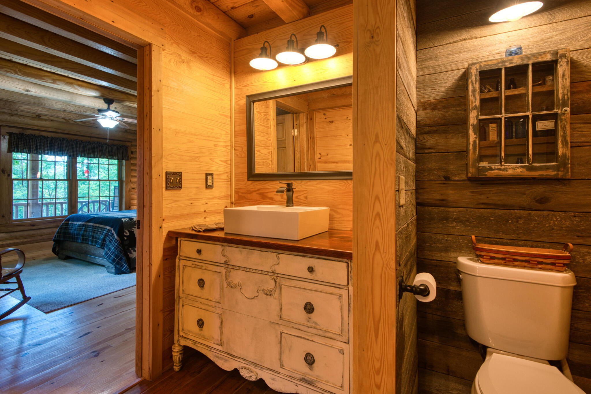 567 Weeks Road Northwest Floyd, VA 24091 - Photo 42 of 71 a bathroom with a granite countertop sink mirror and toilet