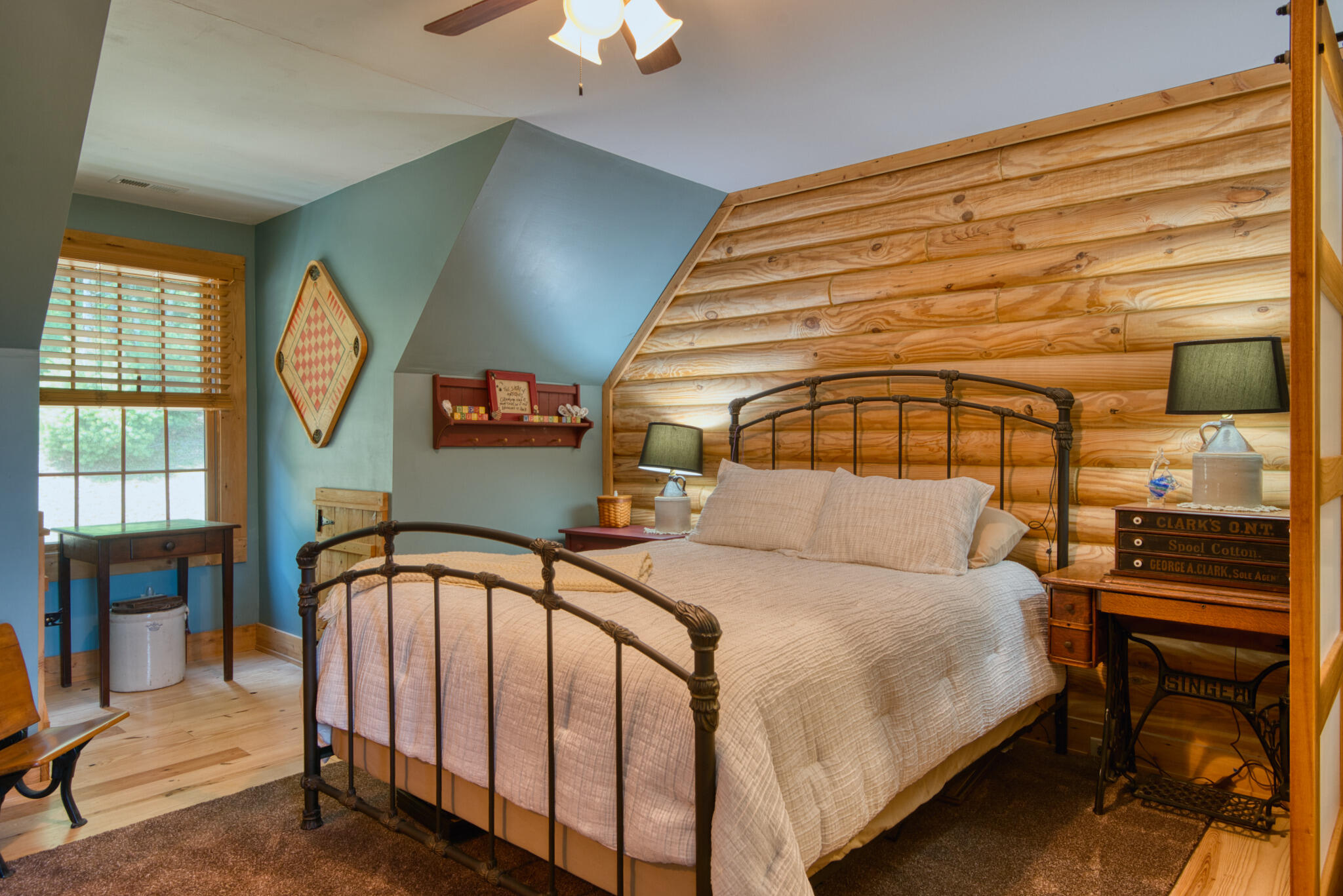 567 Weeks Road Northwest Floyd, VA 24091 - Photo 57 of 71 a bedroom with a bed a chandelier and a large window