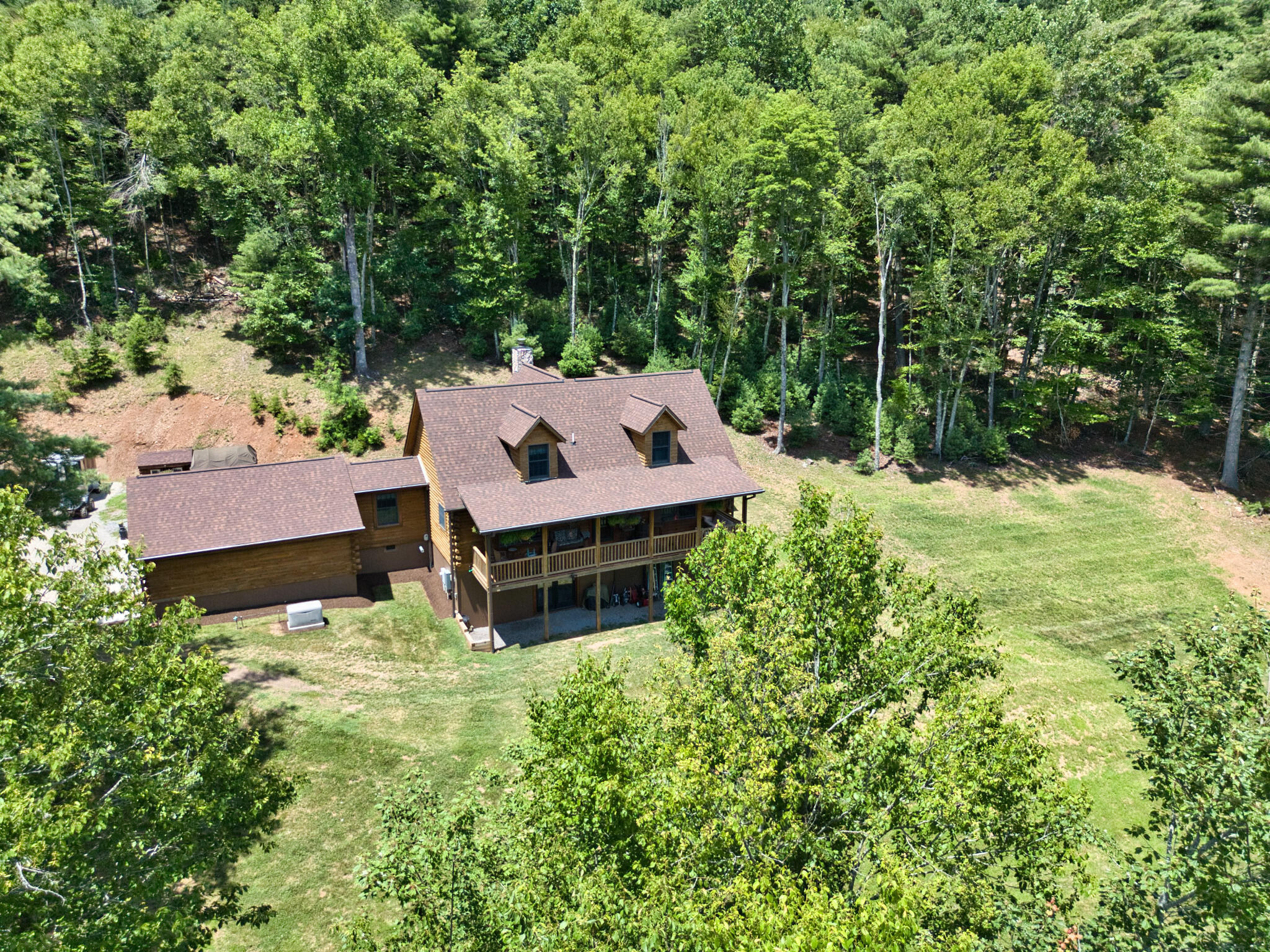 567 Weeks Road Northwest Floyd, VA 24091 - Photo 6 of 71 an aerial view of a house with yard and large trees