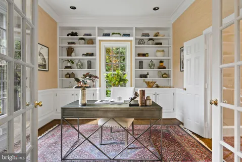 a bathroom with a granite countertop toilet sink and mirror
