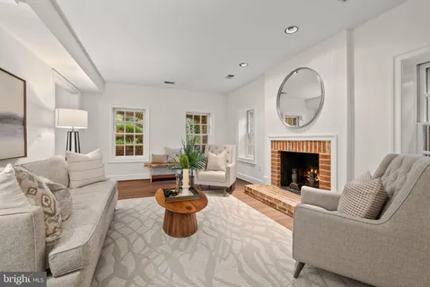 a view of a garden with flowers and trees