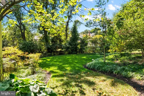 a bathroom with a bathtub and a window