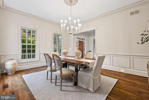 a view of green field with trees in the background