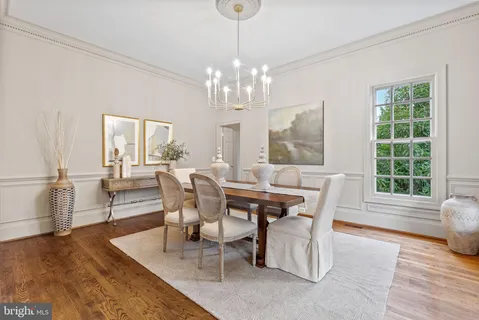a living room with furniture and floor to ceiling windows
