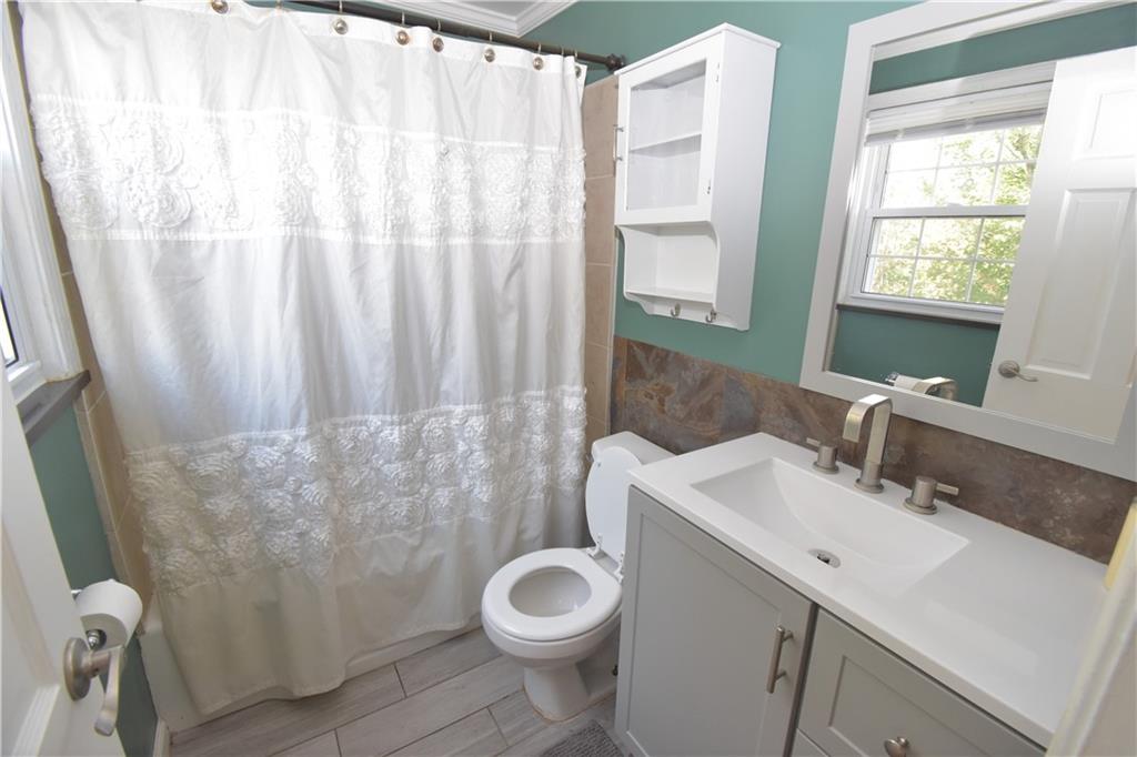 223 Nantucket Drive Pittsburgh, PA 15236 - Photo 12 of 25 a bathroom with a sink a toilet and tub