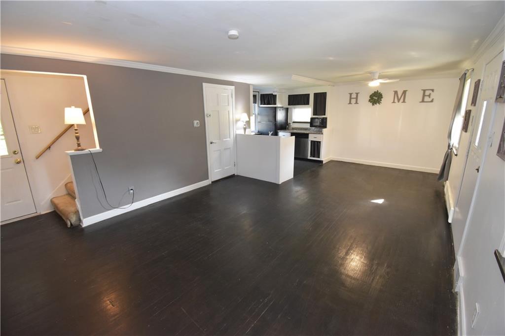 223 Nantucket Drive Pittsburgh, PA 15236 - Photo 3 of 25 a view of a big room with wooden floor and windows