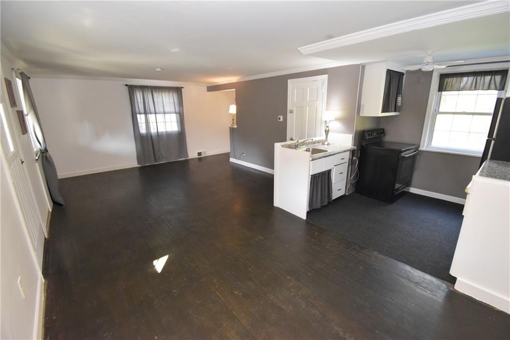 223 Nantucket Drive Pittsburgh, PA 15236 - Photo 5 of 25 a view of a kitchen with a sink dishwasher a stove and wooden floor