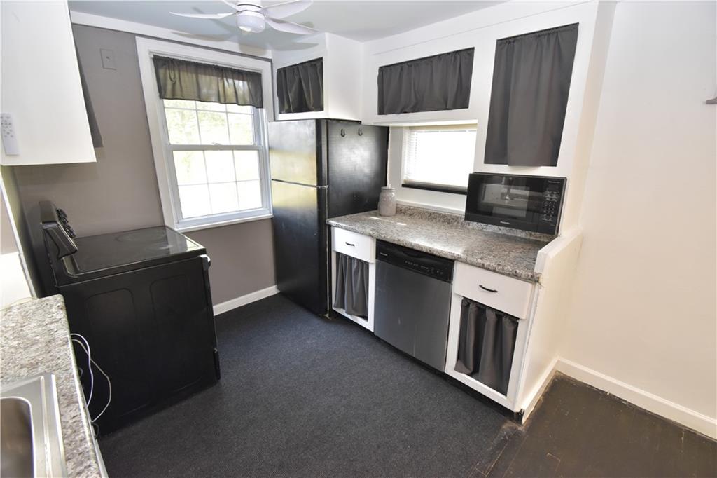 223 Nantucket Drive Pittsburgh, PA 15236 - Photo 6 of 25 a kitchen with stainless steel appliances granite countertop a refrigerator stove and microwave