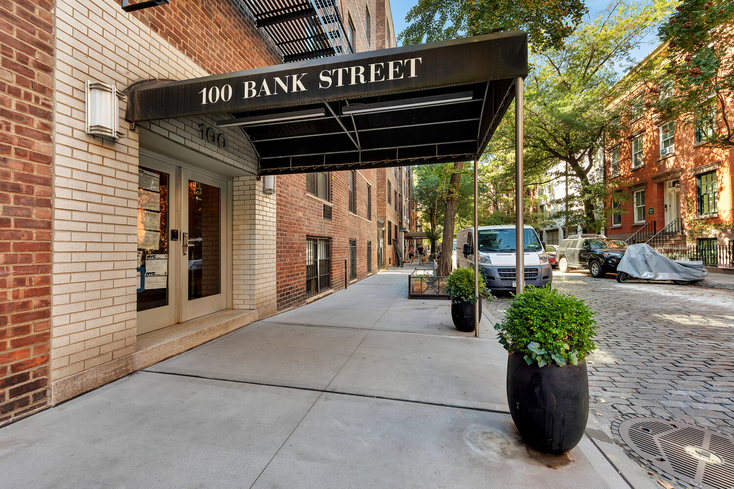 100 Bank Street, Unit 2B Manhattan, NY 10014 - Photo 8 of 9 a view of a patio with table and chairs potted plants