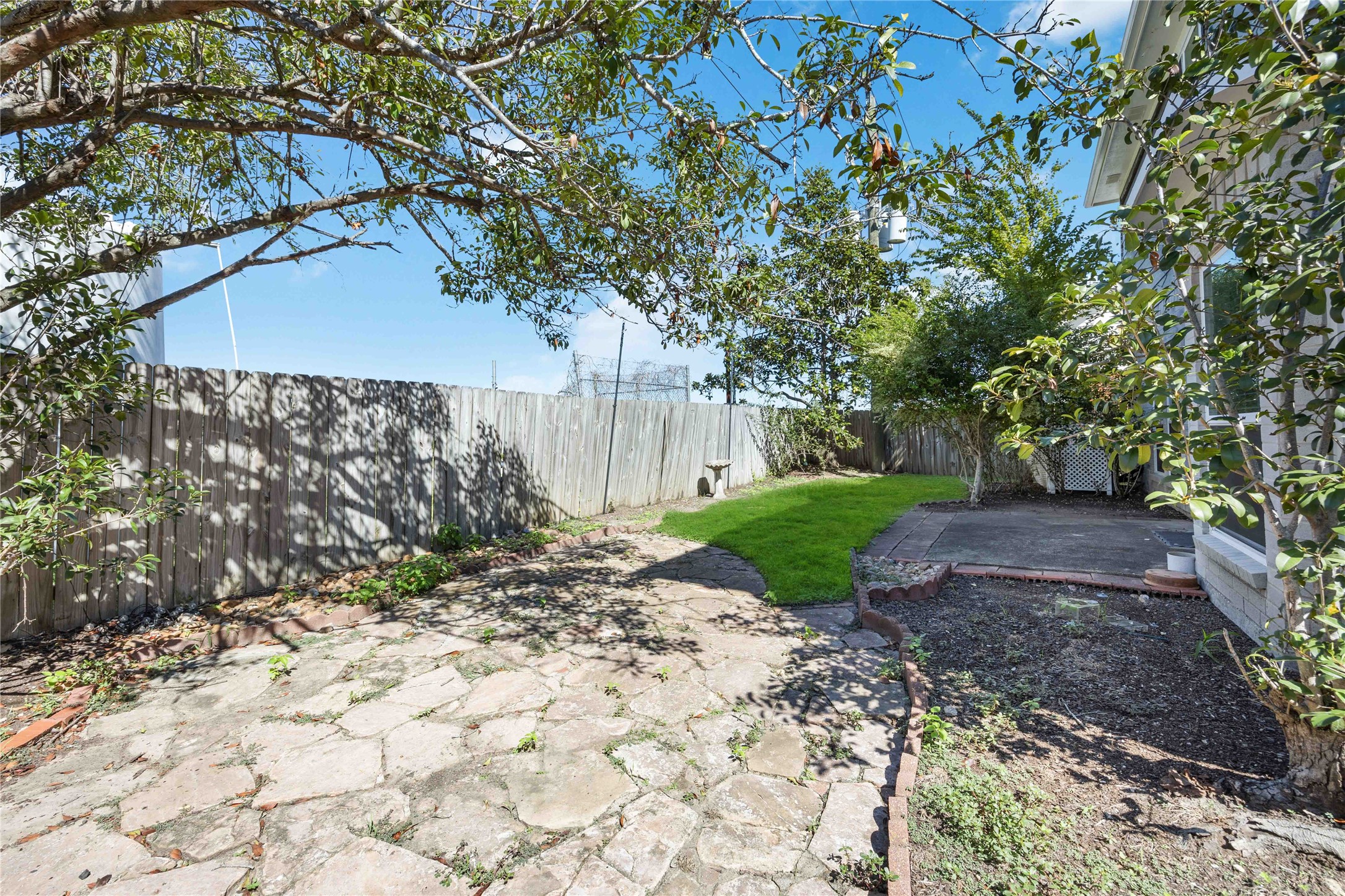 12714 Sandri Lane Houston, TX 77077 - Photo 28 of 28 a view of a yard with plants and a large tree