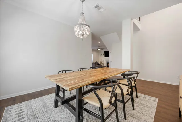 a view of a dining table and chairs in a room