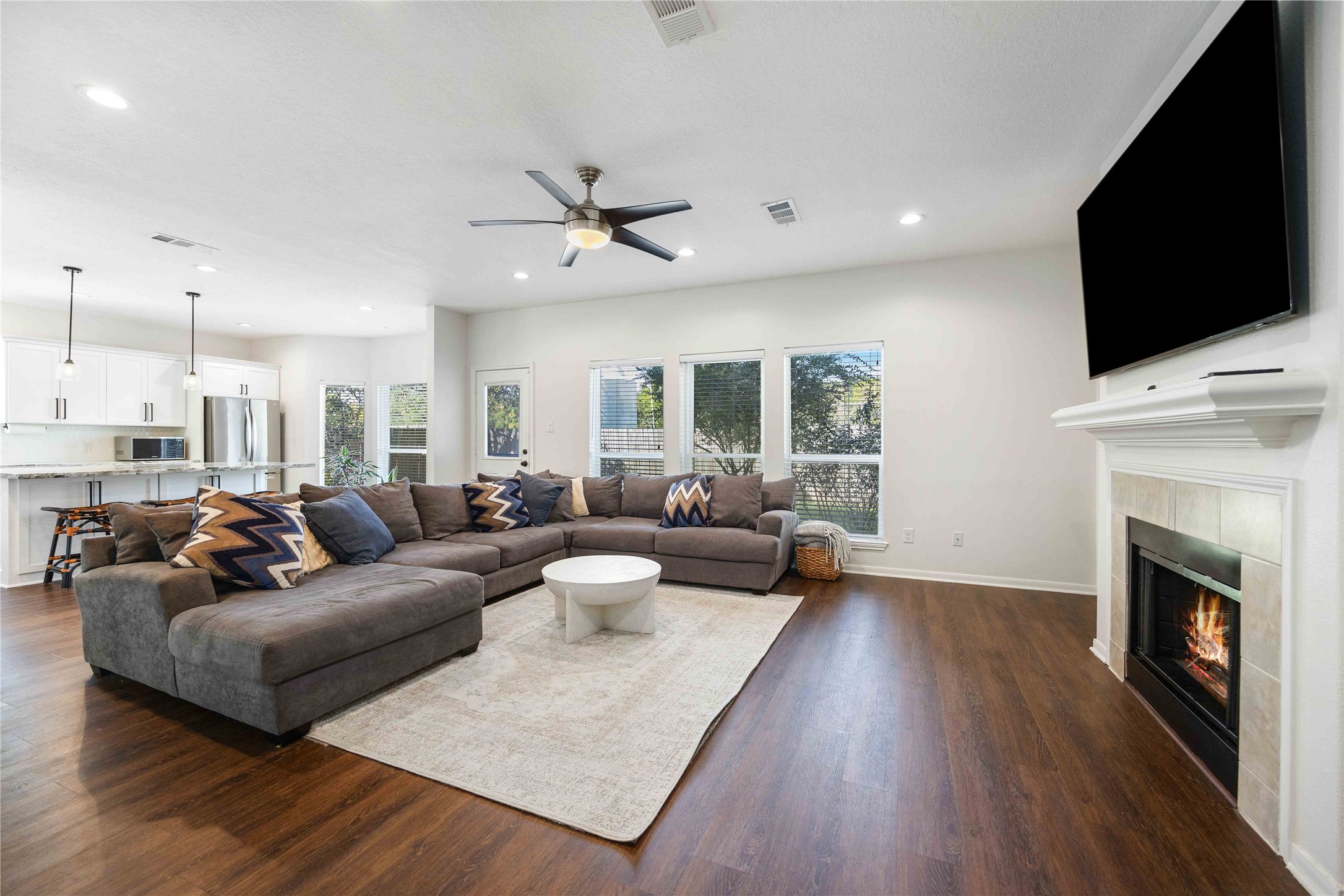 12714 Sandri Lane Houston, TX 77077 - Photo 9 of 28 a living room with furniture fireplace and a flat screen tv