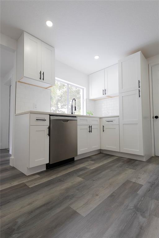6340 Westport Drive Port Richey, FL 34668 - Photo 14 of 51 a view of a kitchen with wooden floor