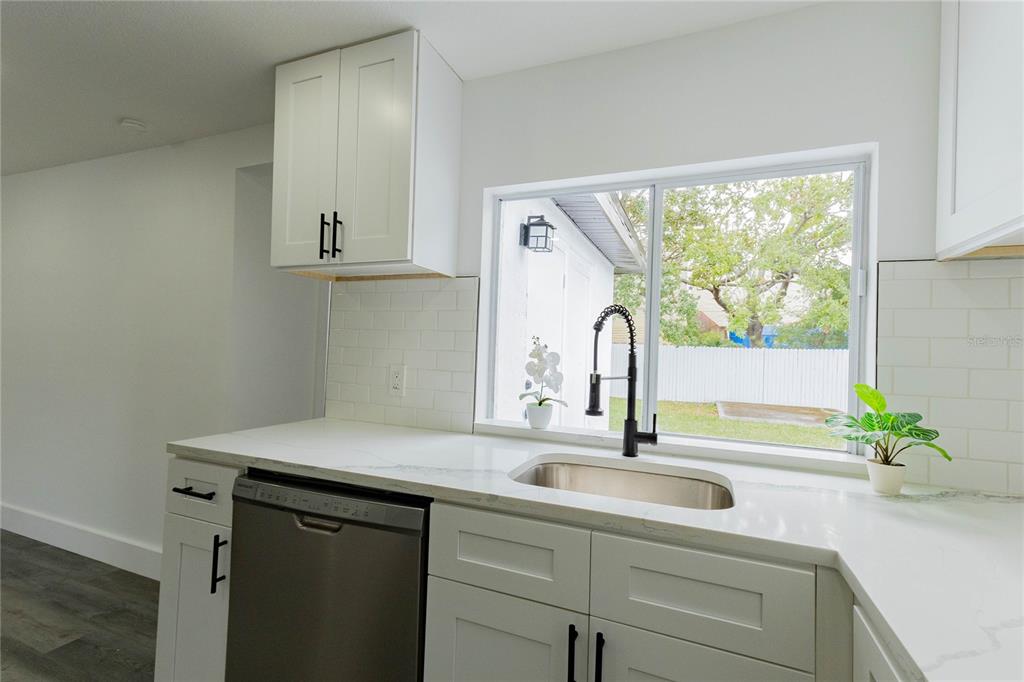6340 Westport Drive Port Richey, FL 34668 - Photo 18 of 51 a kitchen with a sink and a window