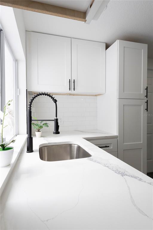 6340 Westport Drive Port Richey, FL 34668 - Photo 19 of 51 a kitchen with a sink and a refrigerator