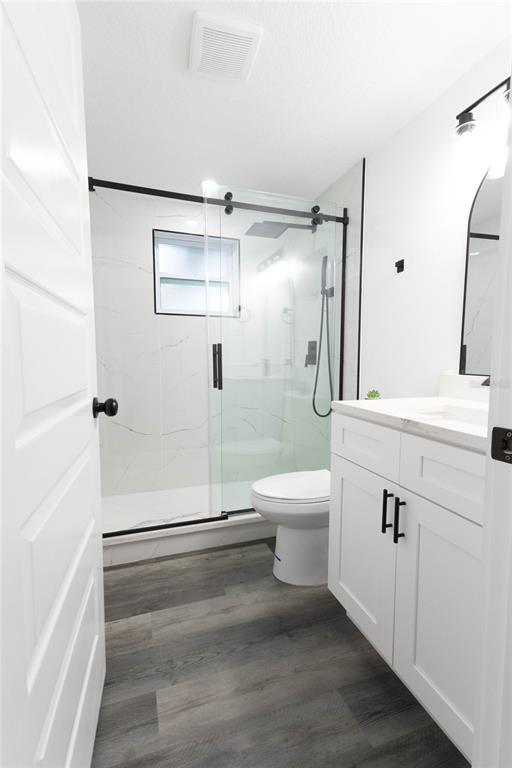 6340 Westport Drive Port Richey, FL 34668 - Photo 20 of 51 a bathroom with a toilet sink and a shower