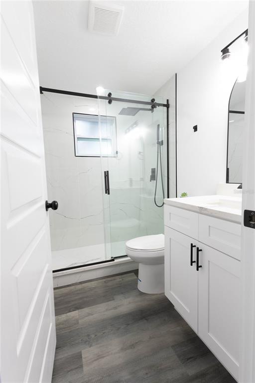 6340 Westport Drive Port Richey, FL 34668 - Photo 21 of 51 a bathroom with a sink a toilet and shower