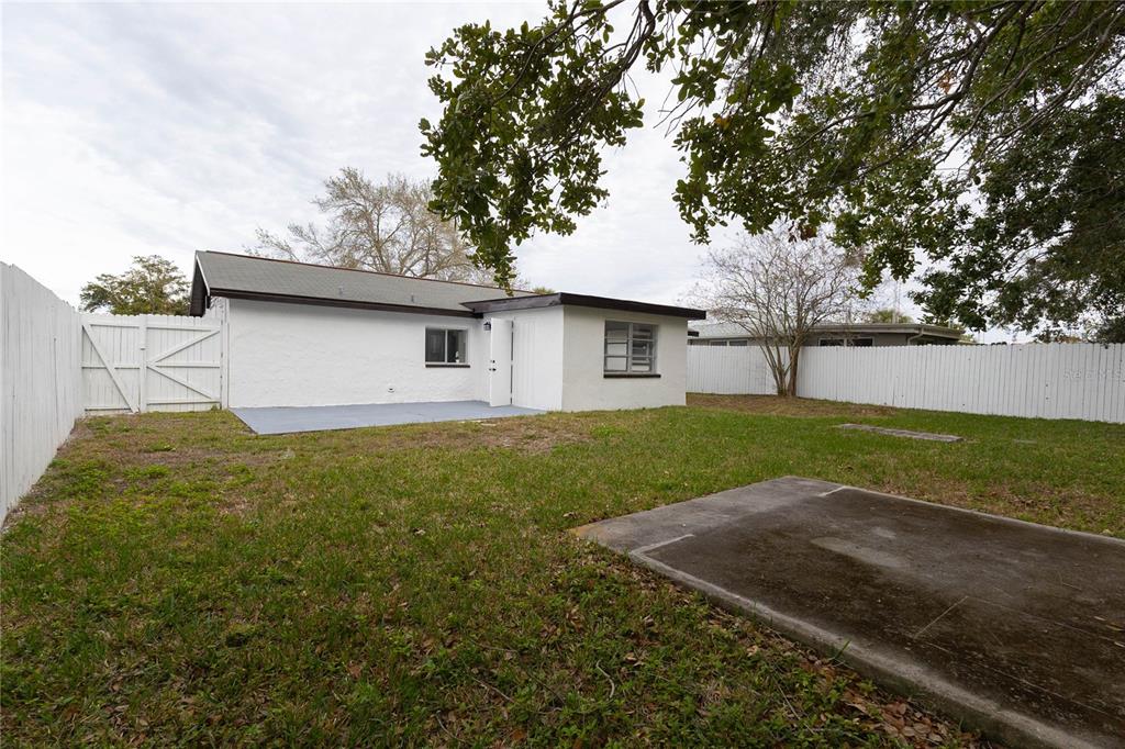6340 Westport Drive Port Richey, FL 34668 - Photo 39 of 51 a view of a house with backyard and garden