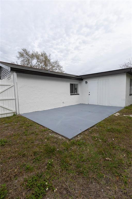 6340 Westport Drive Port Richey, FL 34668 - Photo 42 of 51 a backyard of a house