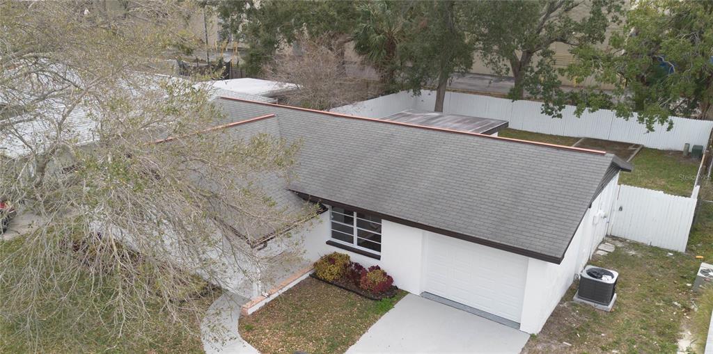 6340 Westport Drive Port Richey, FL 34668 - Photo 46 of 51 a backyard of a house with large trees and plants