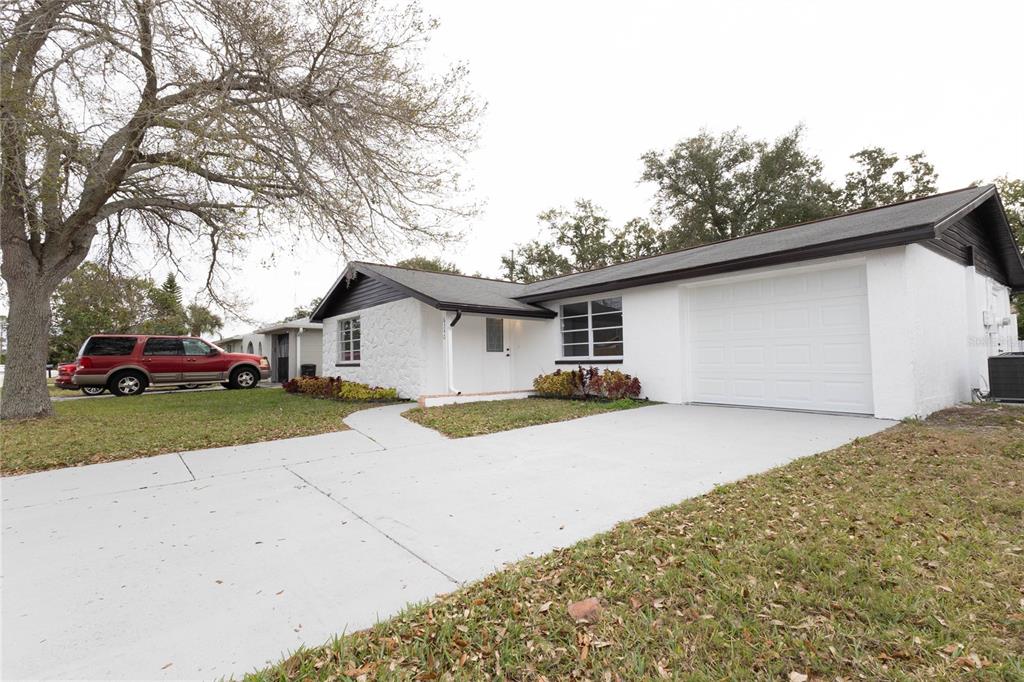 6340 Westport Drive Port Richey, FL 34668 - Photo 5 of 51 a house view with a outdoor space
