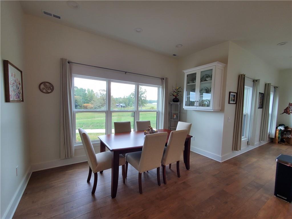 876 Cline Road Resaca, GA 30735 - Photo 11 of 78 a view of a dining room with furniture window and wooden floor