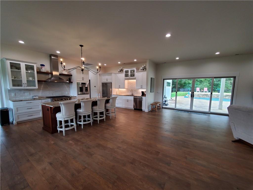 876 Cline Road Resaca, GA 30735 - Photo 2 of 78 an open kitchen with a table and chairs