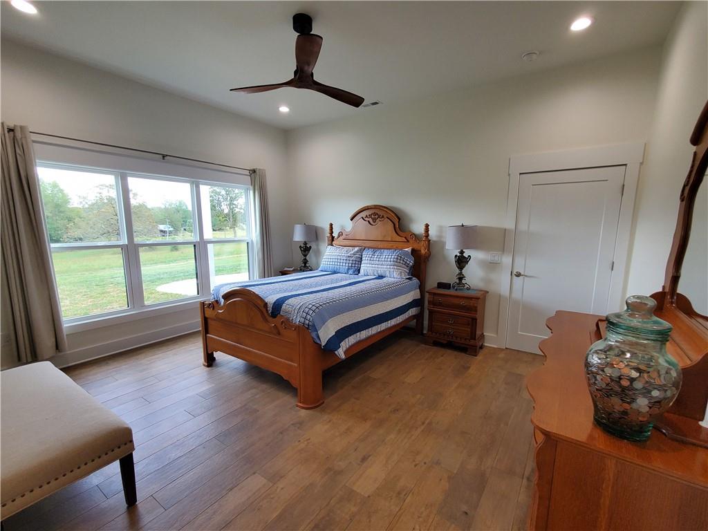 876 Cline Road Resaca, GA 30735 - Photo 21 of 78 a spacious bedroom with a bed and a large window