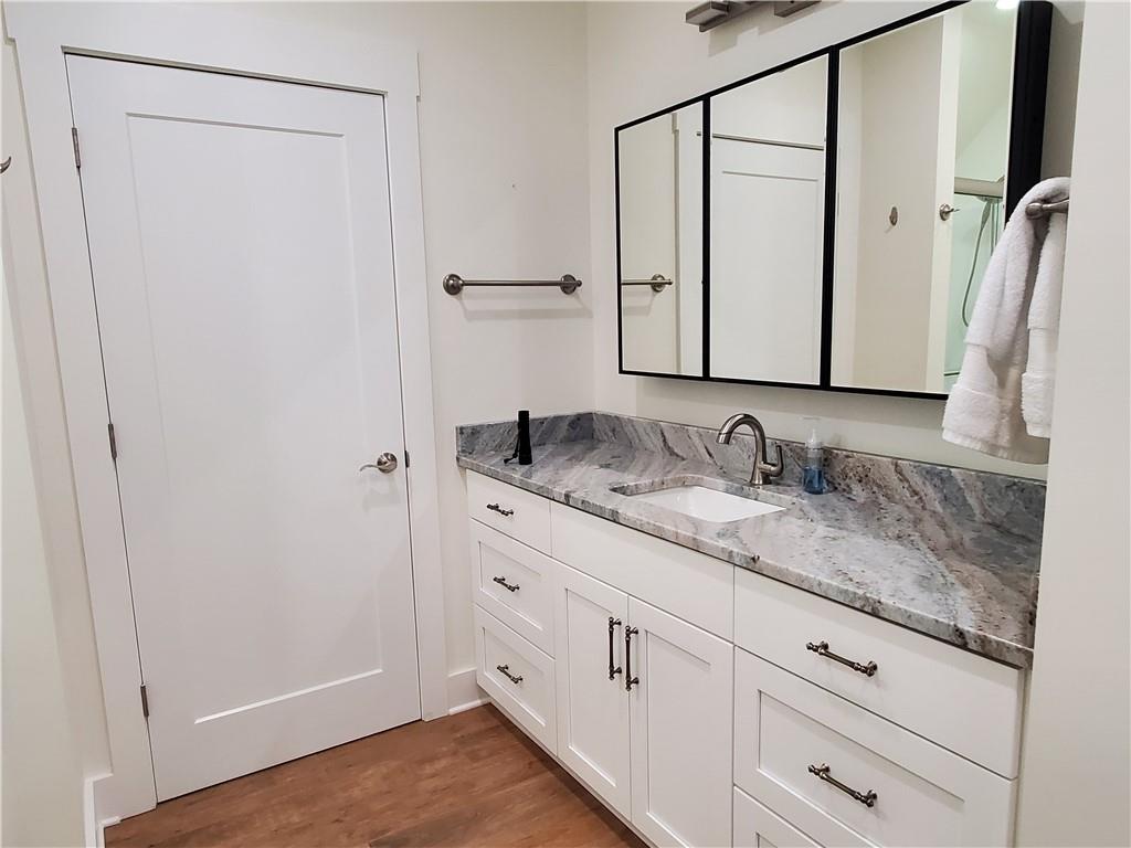 876 Cline Road Resaca, GA 30735 - Photo 32 of 78 a bathroom with a granite countertop sink and a mirror