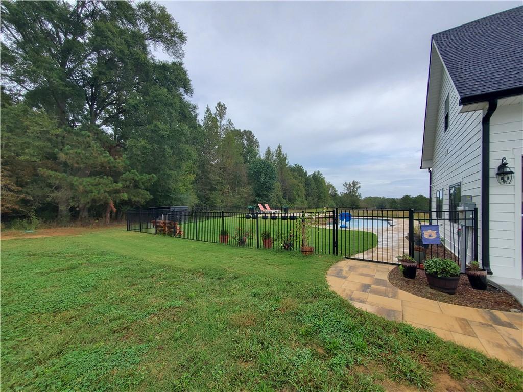 876 Cline Road Resaca, GA 30735 - Photo 50 of 78 a view of a garden with plants and large trees