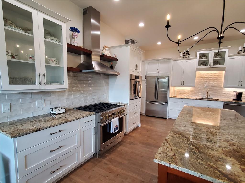 876 Cline Road Resaca, GA 30735 - Photo 5 of 78 a kitchen with stainless steel appliances granite countertop a stove a sink and a refrigerator