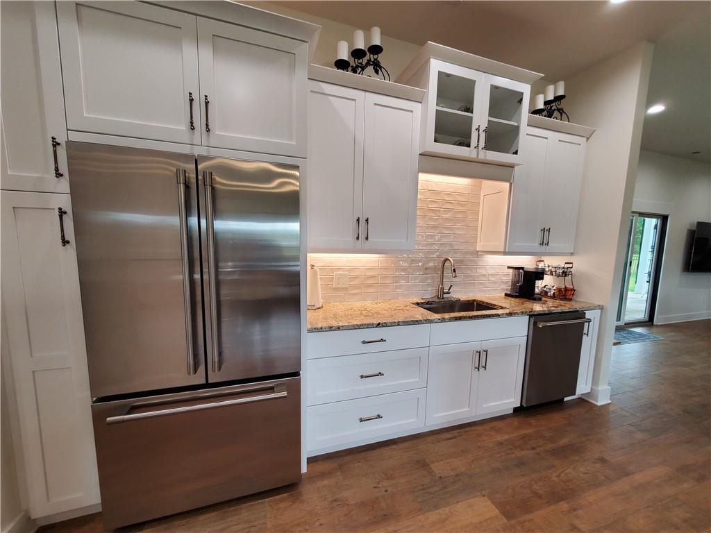 876 Cline Road Resaca, GA 30735 - Photo 6 of 78 a kitchen with granite countertop stainless steel appliances and refrigerator