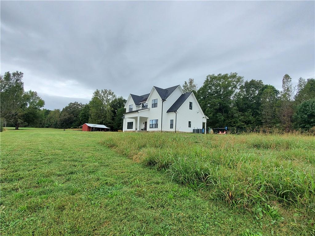876 Cline Road Resaca, GA 30735 - Photo 61 of 78 a view of a house with yard and a garden