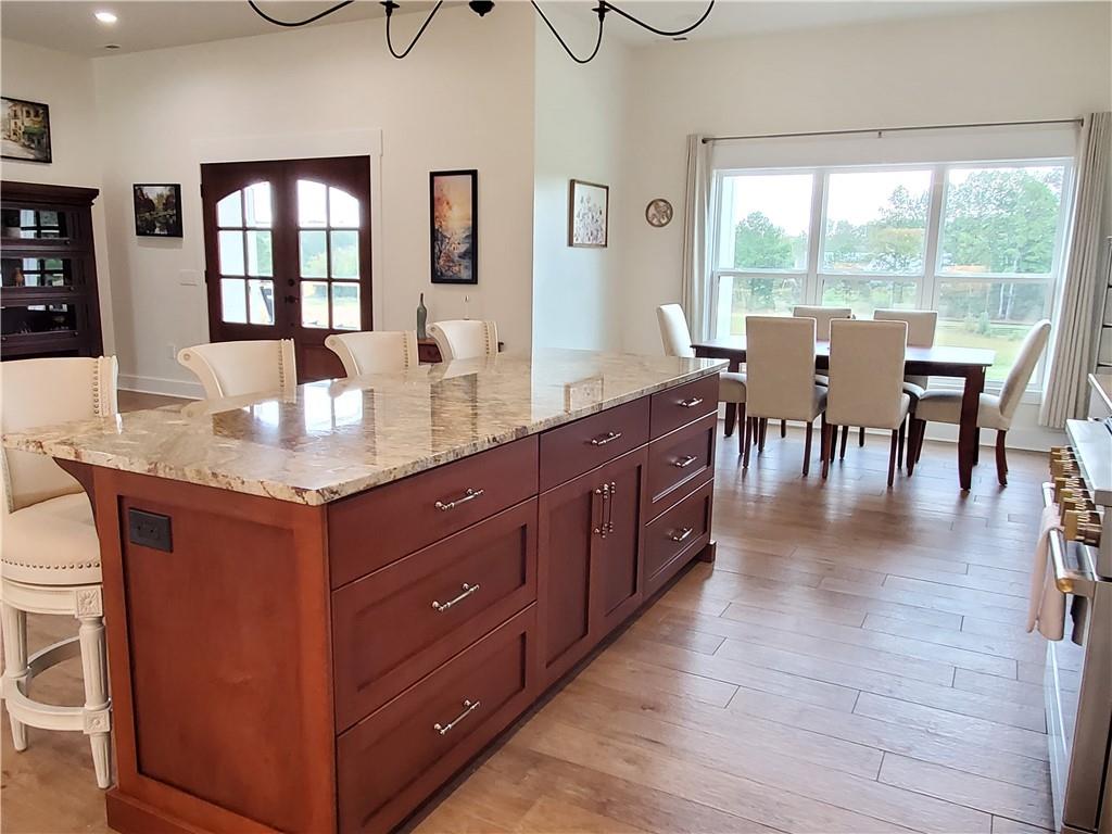 876 Cline Road Resaca, GA 30735 - Photo 8 of 78 a dining hall with stainless steel appliances granite countertop a stove and a sink with granite countertops