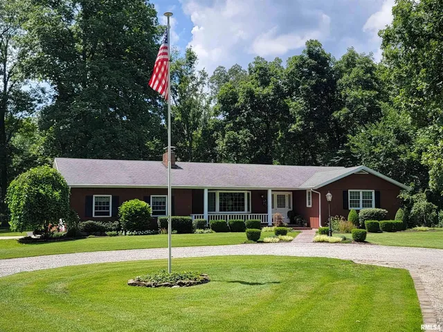 a house with swimming pool in front of it