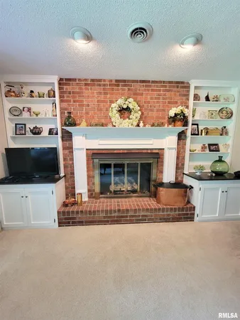 a dining room with furniture and a mirror