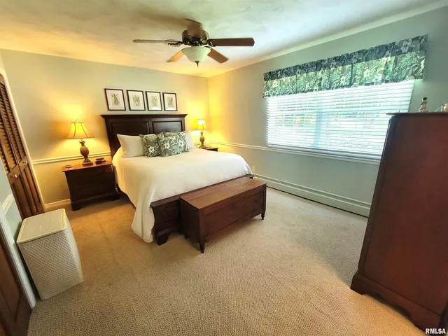 a view of a garden with furniture