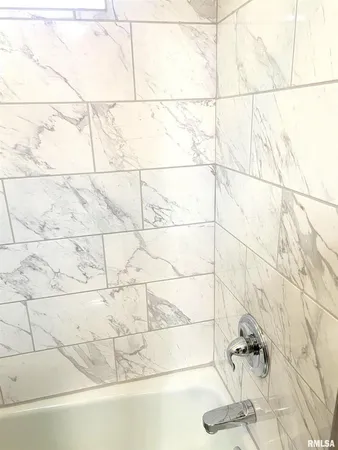 an aerial view of a house with a yard and garden space