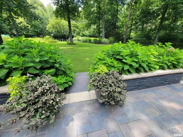a view of a backyard with a garden