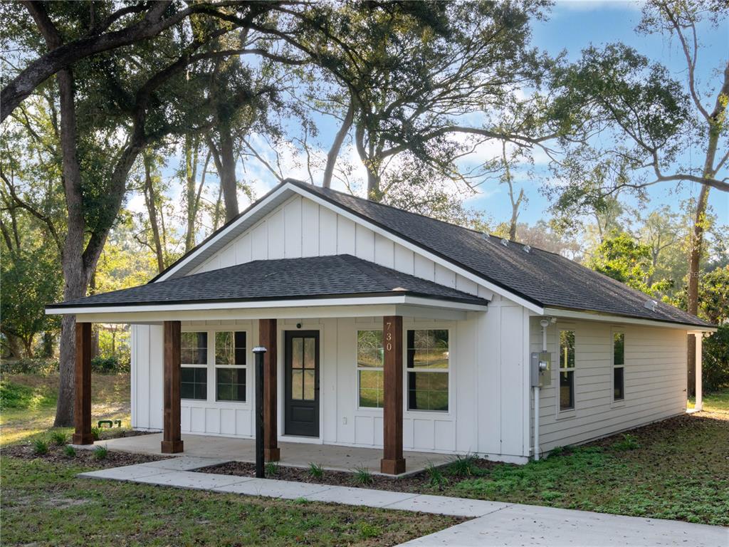 front view of a house with a yard