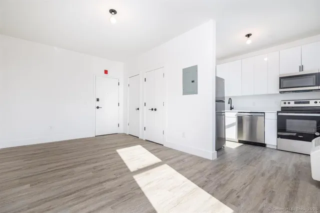 a view of kitchen with wooden floor
