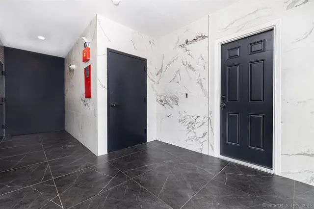 an empty room with an entryway door