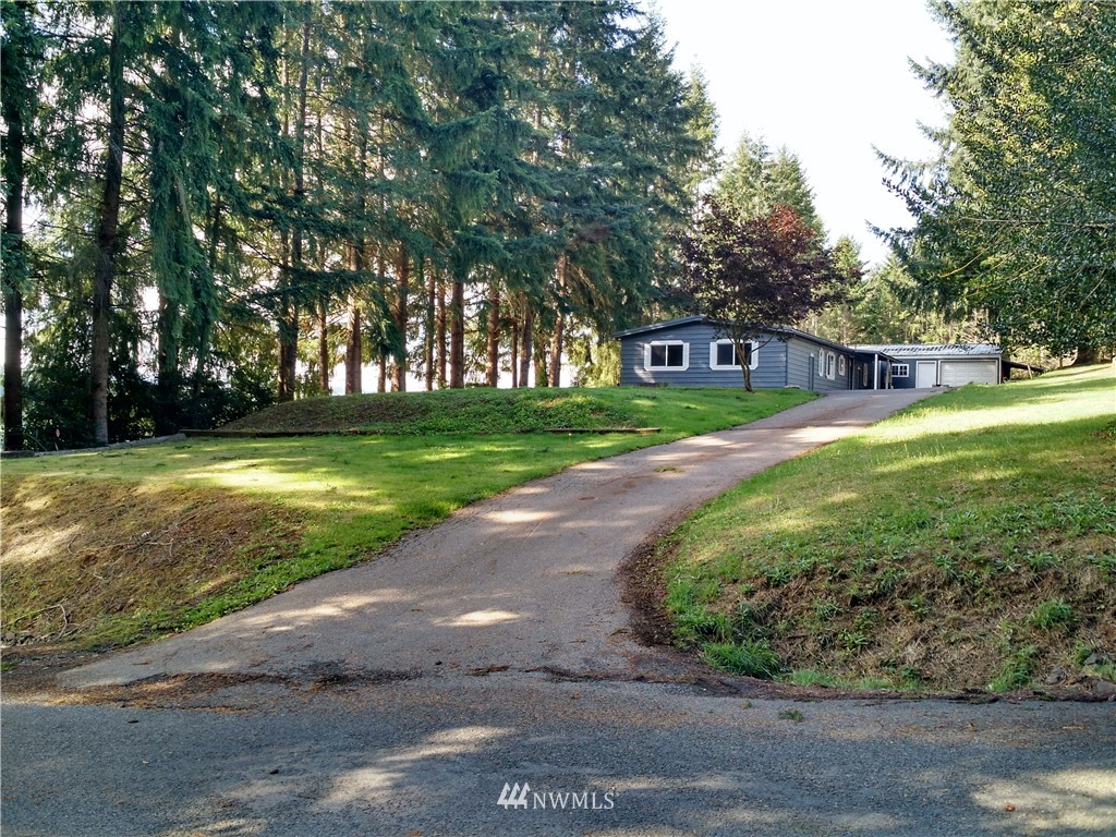 150 Nix Road Chehalis, WA 98532 - Photo 1 of 13 a view of a big yard with large trees and plants