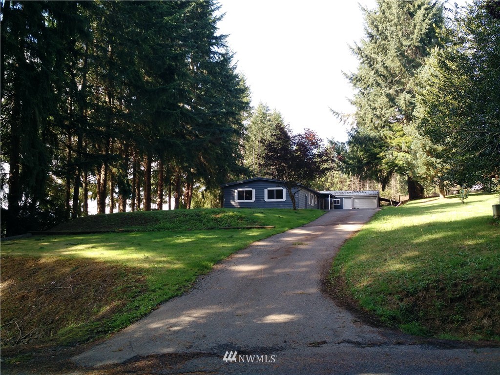 150 Nix Road Chehalis, WA 98532 - Photo 2 of 13 a view of a big house in a big yard with large trees