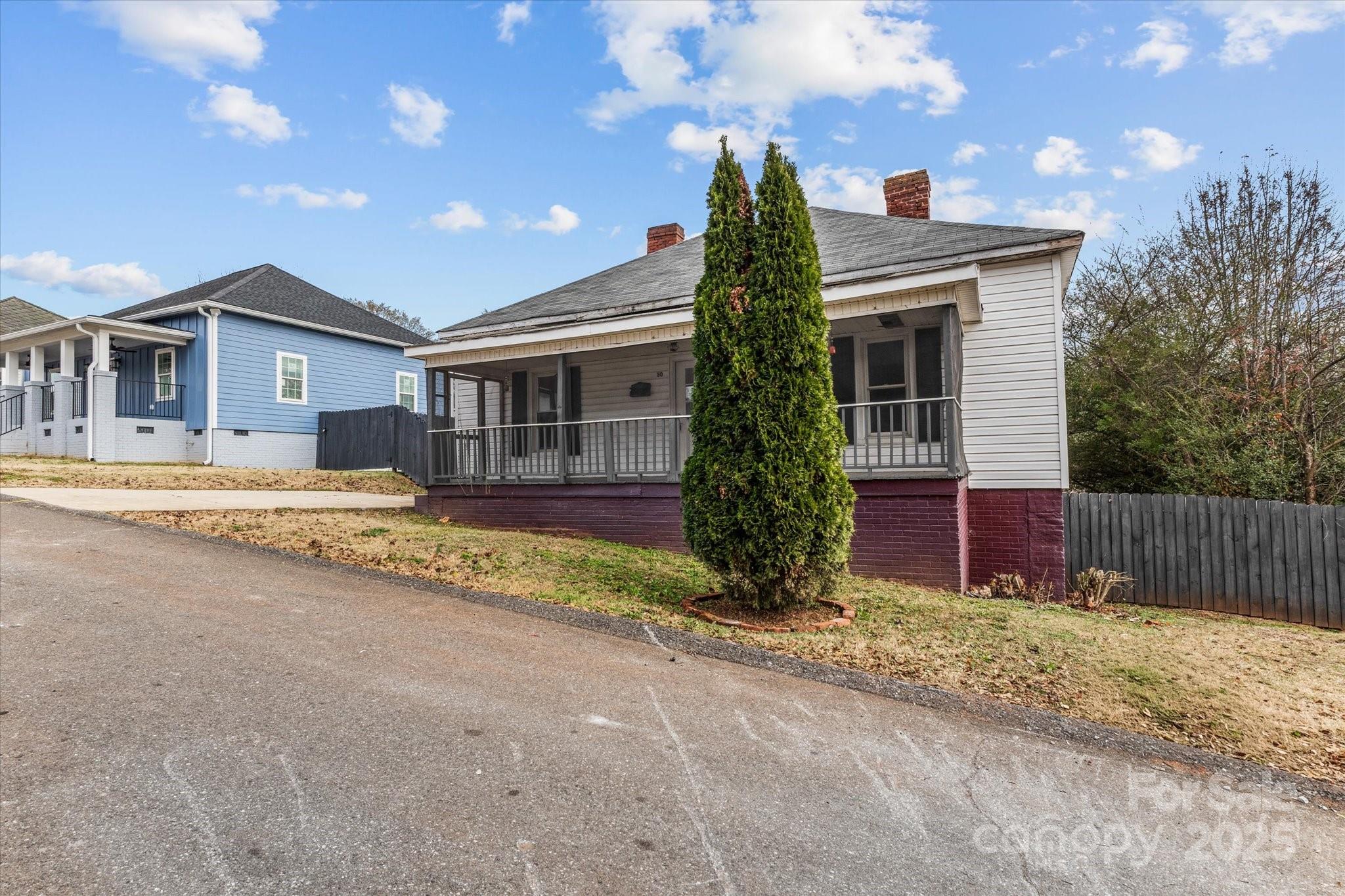 30 2nd Street Cramerton, NC 28032 - Photo 2 of 21 a view of a house with a yard and large tree