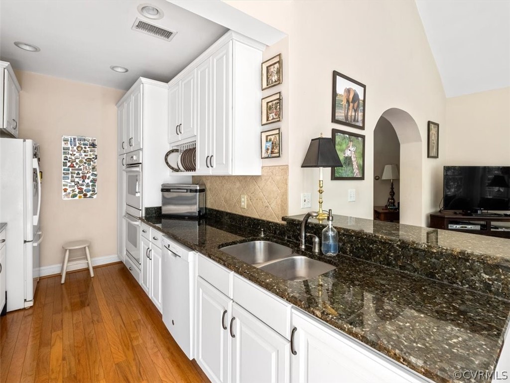 4610 Butte Road Richmond, VA 23235 - Photo 14 of 48 a kitchen with granite countertop a sink a counter top space and cabinets