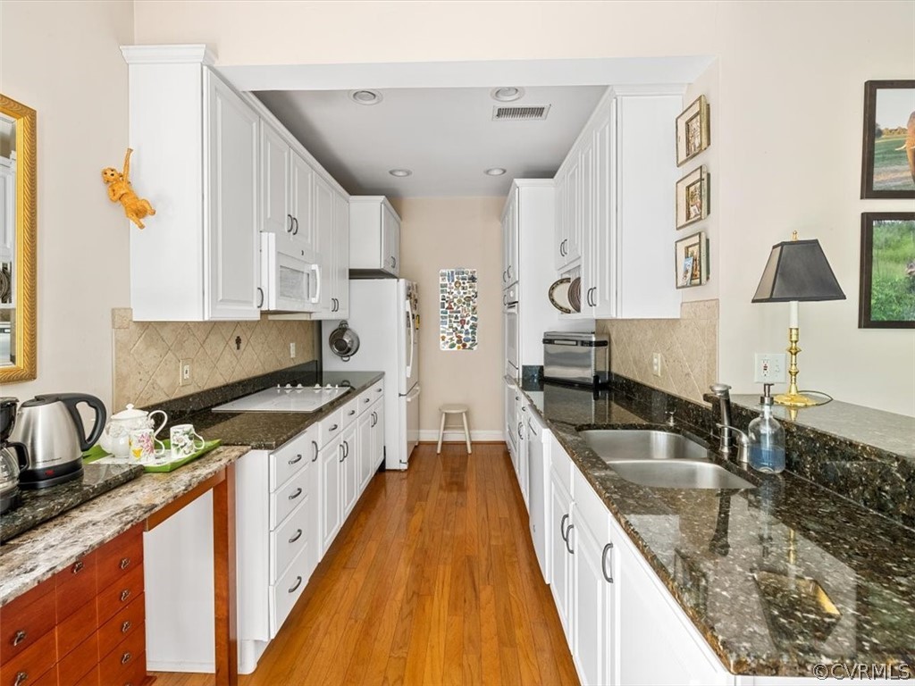 4610 Butte Road Richmond, VA 23235 - Photo 16 of 48 a large kitchen with stainless steel appliances granite countertop a sink and a stove